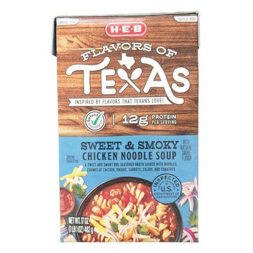 A 17-ounce carton of H-E-B "Flavors of Texas" Sweet & Smoky Chicken Noodle Soup. The blue bottom label features a bowl of soup with chicken, noodles, and corn in a dark, smoky broth. It is labeled with "12g Protein per serving".