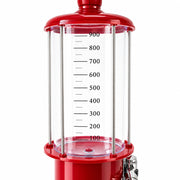 Close-up of the red gas pump beverage dispenser's clear measured reservoir and chrome tap