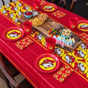 Picnic table set with Buc-ee's party napkins, plates, cups and snacks