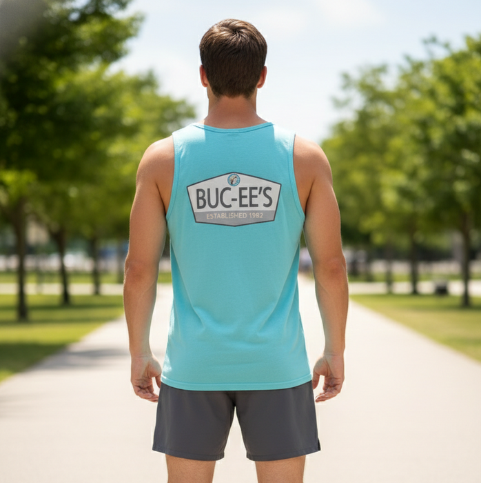 Person wearing a light blue tank top with 'Buc-EE's' logo on a sunny day.