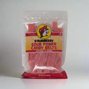 A package of Buc-ee's Sour Power Candy Belts, with watermelon flavor, visible through the clear plastic of the bag. The bag is labeled with the product name and the flavor, and features the Buc-ee's logo at the top.
