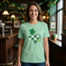 Woman wearing a green t-shirt with a graphic design in a bar setting