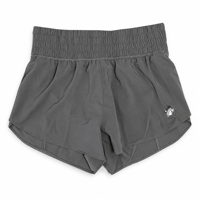 Buc-ee’s Performance Shorts in charcoal gray with smocked high-rise waistband, curved hem, and tonal beaver logo