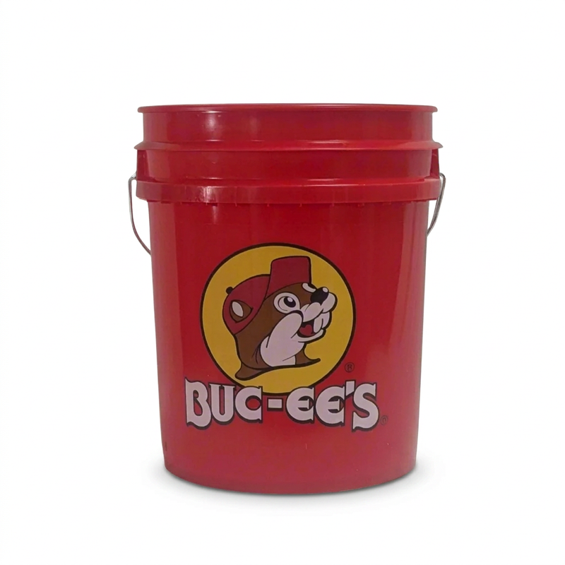 Buc-ee’s red plastic bucket with metal wire handle and yellow beaver logo with white wordmark printed on the front