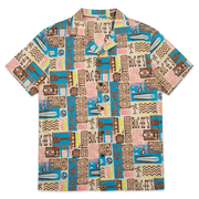 Buc-ee’s Tiki Camper Shirt, short-sleeve button-up with camp collar and print of ukuleles, surfboards, and tiki masks