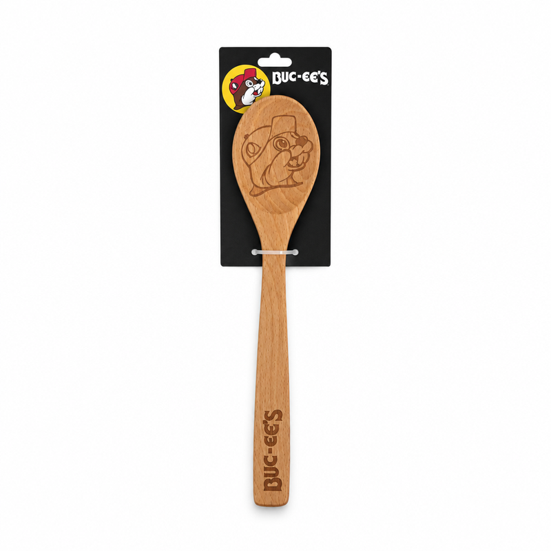 Buc-ee's wooden spoon with the beaver mascot engraved on the bowl and the logo on the handle, on a black hang card
