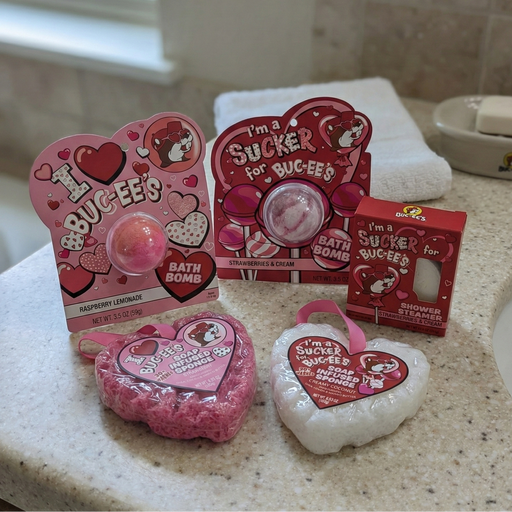Bucee's bath bombs and shower steamers on a bathroom counter.