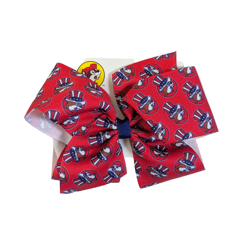 Buc-ee’s 4th of July hair bow, king size, in red with a print of the beaver mascot in a stars and stripes top hat