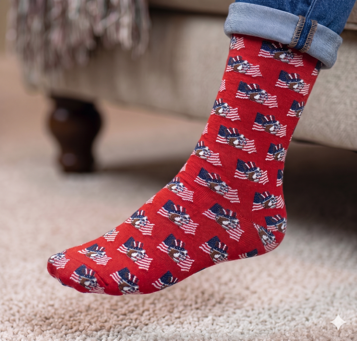Red sock with American flag pattern worn indoors on a carpeted floor.