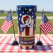 Yukon Outfitters tumbler with American flag design on a checkered tablecloth