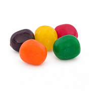 Buc-ee's Assorted Fruit Sours up close, five sour fruit candies in purple, yellow, red, orange, and green