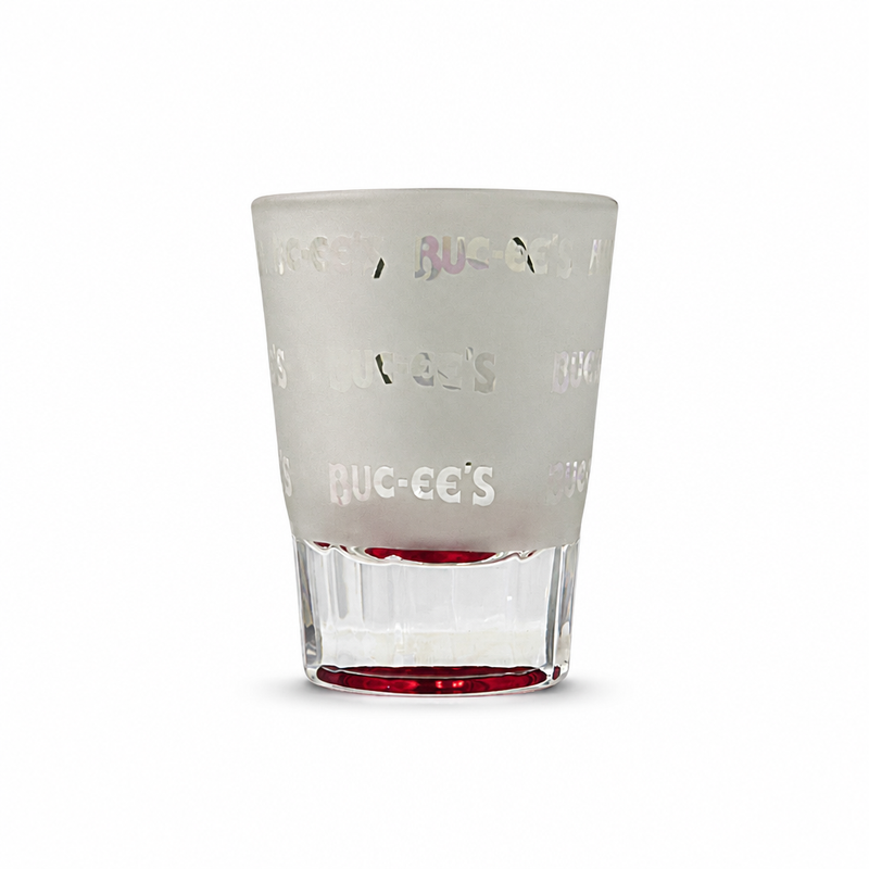 Frosted Buc-ee's Bastrop shot glass with etched repeating logo pattern and red base, back view