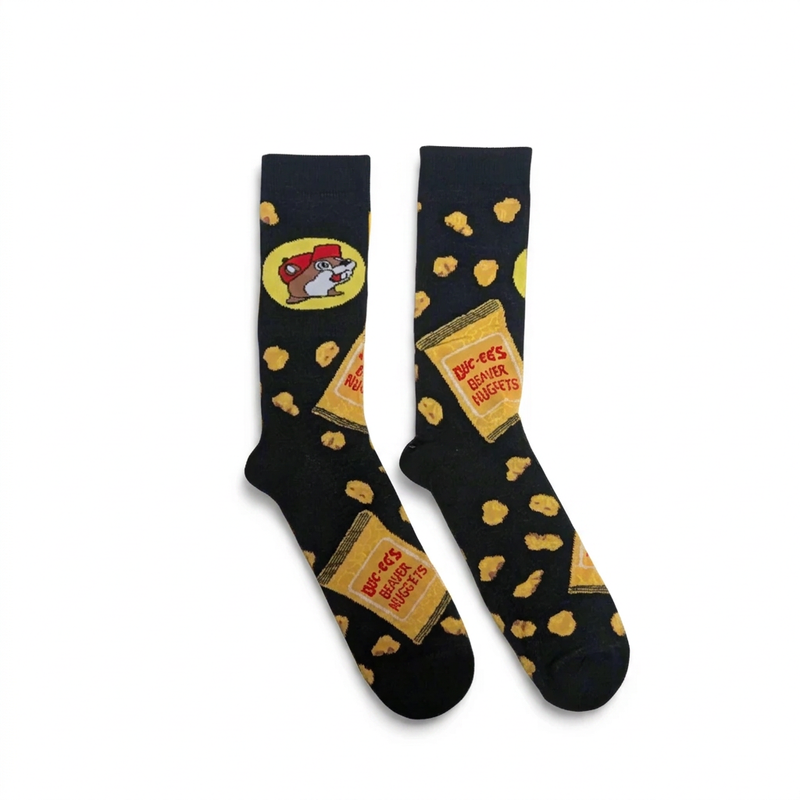 Buc-ee’s Beaver Nugget crew socks in black with a knit pattern of Beaver Nuggets bags, scattered nuggets, and the beaver logo