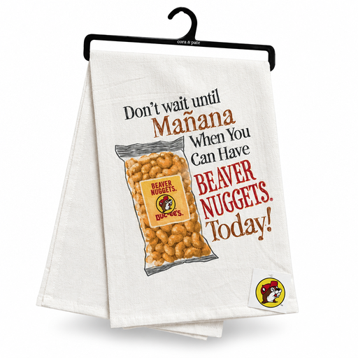 White tea towel on a hanger printed with a Beaver Nuggets bag and "Don't Wait Until Mañana" slogan
