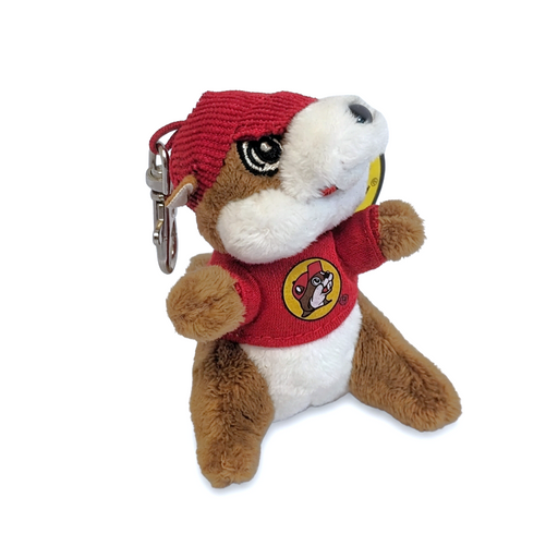 Buc-ee’s beaver plush keychain with a red knit cap, red logo T-shirt and silver metal clip, shown from an angle