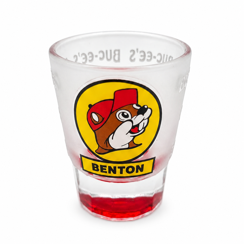 Frosted Buc-ee's Benton shot glass with yellow Buc-ee the Beaver logo and red base, on white