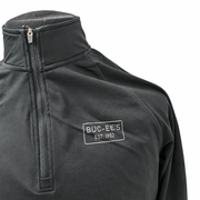 Buc-ee's black quarter-zip pullover chest detail with light gray EST. 1982 rectangle logo, metal zipper pull, and stand collar