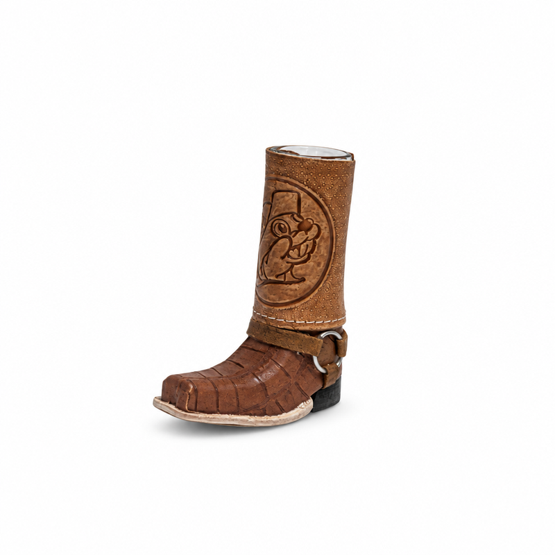Buc-ee's Boot Shot glass shaped like a brown cowboy boot with embossed beaver logo, harness strap, and silver ring detail