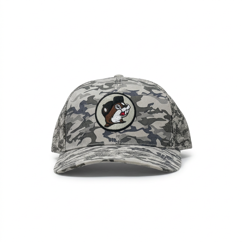 Buc-ee’s camo trucker hat in gray camouflage with embroidered beaver patch and curved brim, front view