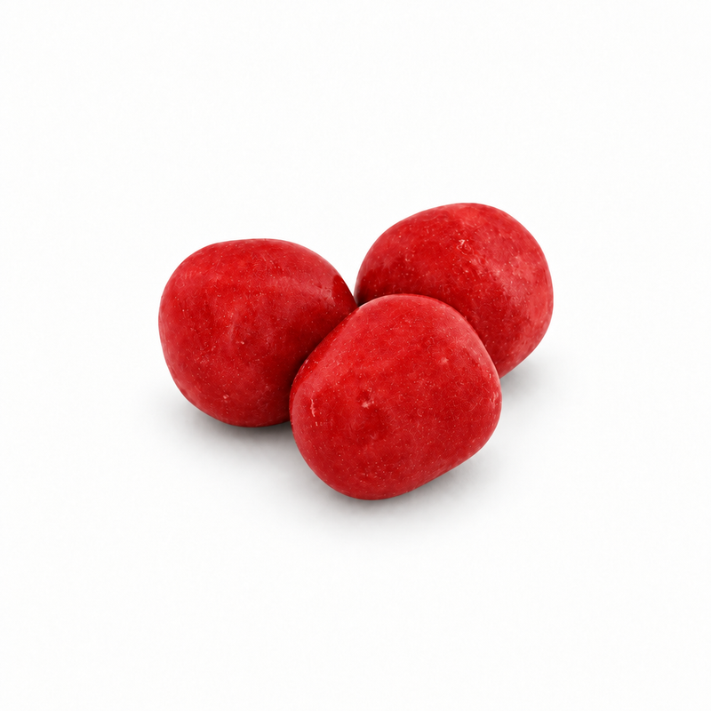 Close-up of three Buc-ee's Cherry Sours, round bright red candies with a sugar-dusted, slightly textured coating