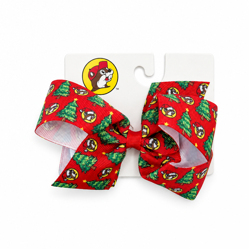 Buc-ee's Christmas hair bow in red grosgrain ribbon with a Santa hat beaver and Christmas tree print, on a display card