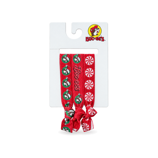 Buc-ee's Christmas hair ties 3-pack in red with beaver ornament, logo script, and peppermint candy prints on a hang card