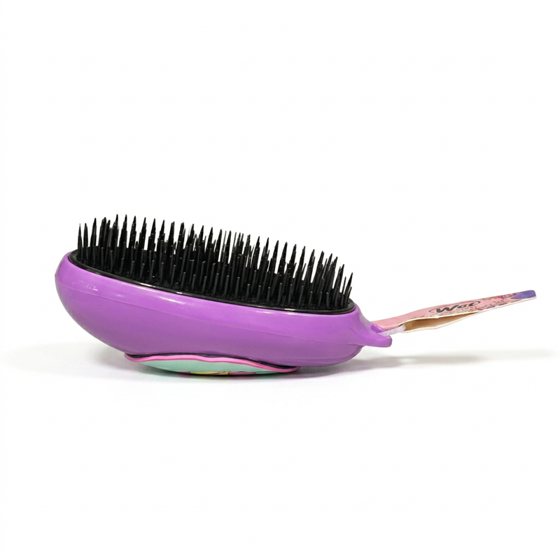 Buc-ee’s purple detangler brush in side profile, showing tall black bristles and the curved palm-shaped base
