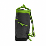 Side of the Buc-ee's Dockside Backpack Cooler showing a slip pocket with lime green trim and a pull tab