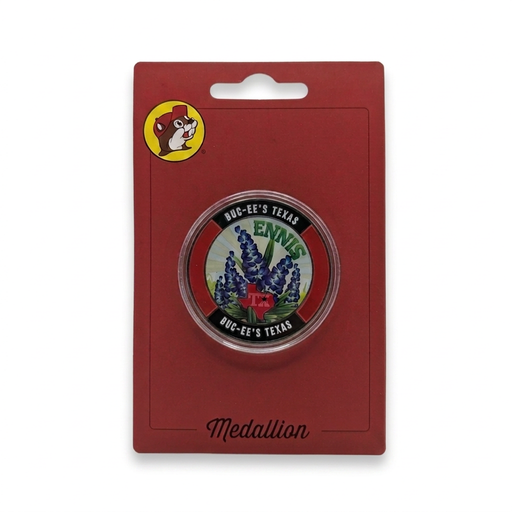 Buc-ee’s Ennis, Texas collectible medallion with bluebonnet design and red Texas map in a clear capsule on red card.
