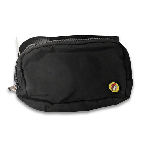 Buc-ee’s fanny pack in black with a zip top, silver zipper pull and round yellow beaver logo patch, strap folded behind