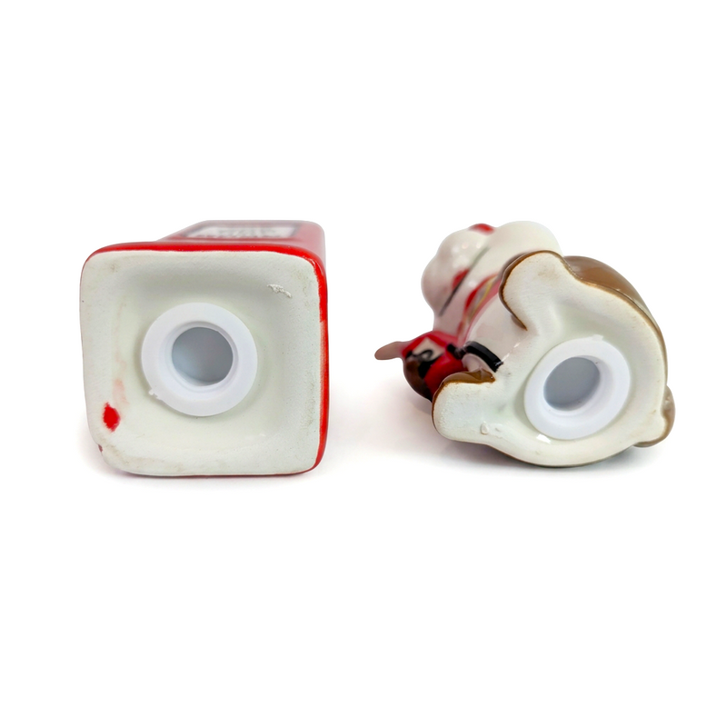 Buc-ee’s Gas Pump Salt & Pepper Shaker set bottom view, showing unglazed bases with white plastic fill stoppers