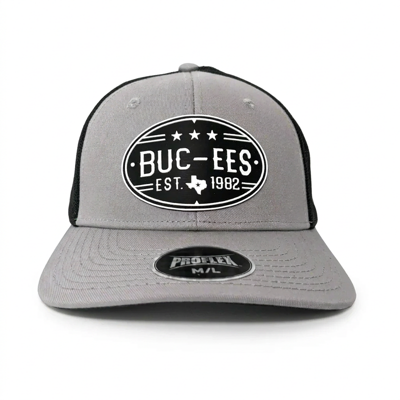 Buc-ee’s gray and black Proflex hat with a mesh back and an oval black patch reading “Buc-ees Est. 1982” with a Texas outline