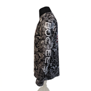 Side view of the gray camo performance long sleeve shirt with white BUC-EE’S lettering printed down the sleeve