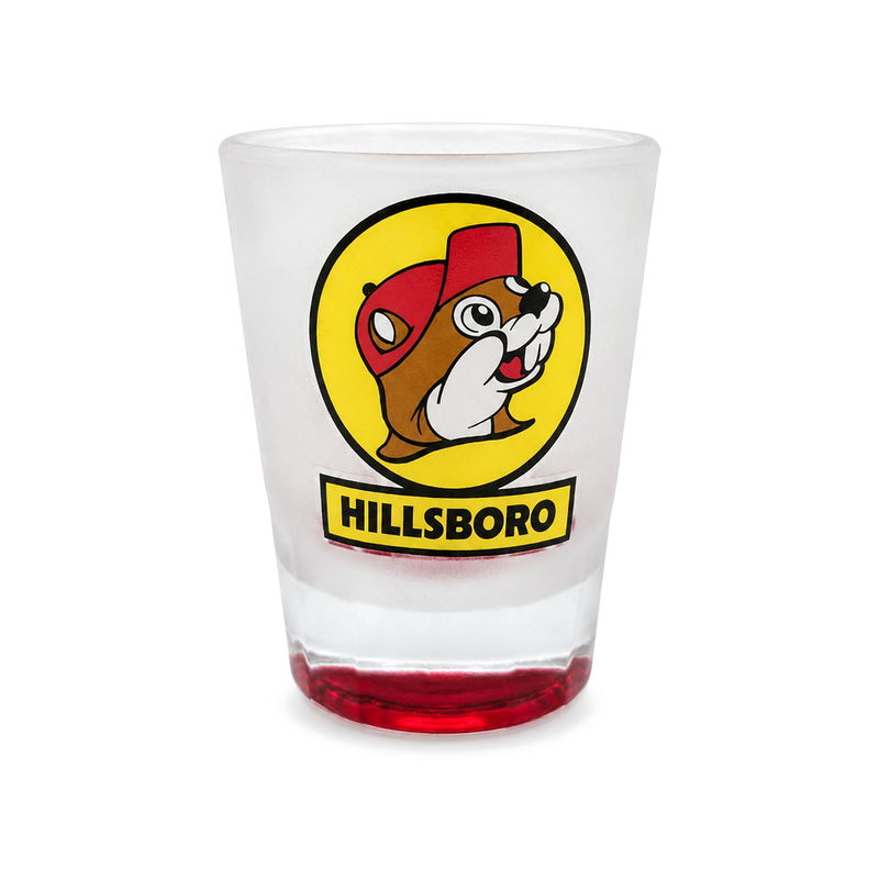 Buc-ee's Hillsboro souvenir shot glass, frosted glass with a red-tinted base and the yellow beaver logo