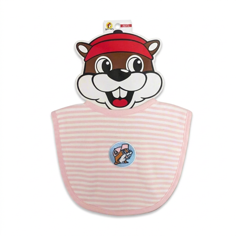 Buc-ee’s infant bib in pink and white stripes with an embroidered beaver patch on a blue circle, on a beaver-face card