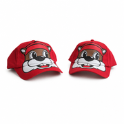 Two Buc-ee's red infant caps angled left and right, showing the side panels, curved brim, and full beaver face print