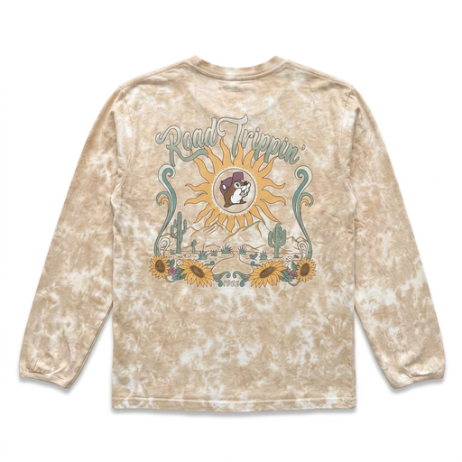 Buc-ee’s tan tie-dye long sleeve sunflower shirt with a “Road Trippin’” desert graphic, sun, cacti, and sunflowers