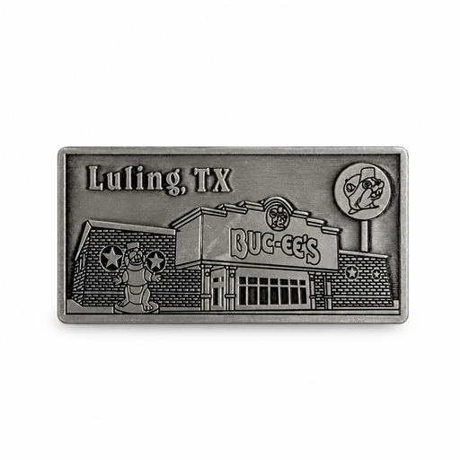 A rectangular antique pewter metal magnet with 3D relief detailing of the Buc-ee's Luling storefront. Features "Luling, TX" engraved in the upper left corner, the Buc-ee's store building with main entrance, the beaver mascot statue out front, and the tall roadside lollipop sign on the right.