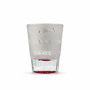 Back of the Buc-ee's Melissa, TX shot glass showing frosted glass with a repeating clear Buc-ee's wordmark pattern