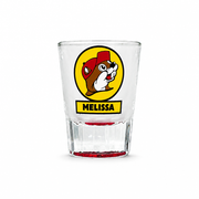 Buc-ee's Melissa, TX shot glass in clear glass with the beaver logo, yellow MELISSA name panel, and red fluted base
