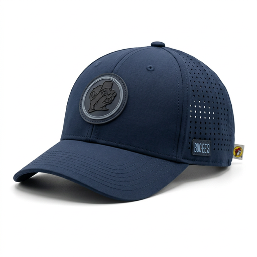 Buc-ee’s navy blue performance hat with a curved brim, tonal gray beaver patch, perforated side panels, and side logo tab