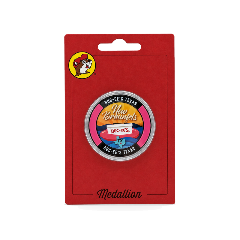 Buc-ee's New Braunfels medallion with a pink rim, sunset, and cooler on a tube float, in a clear case on a red card