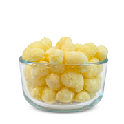 Buc-ee’s Nug-ees White Cheddar baked corn puffs in a clear glass bowl, showing their airy, cheese-dusted texture up close