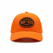 Buc-ee’s Orange Hunter Hat, a blaze orange baseball cap with black oval logo patch and star accents, front view.