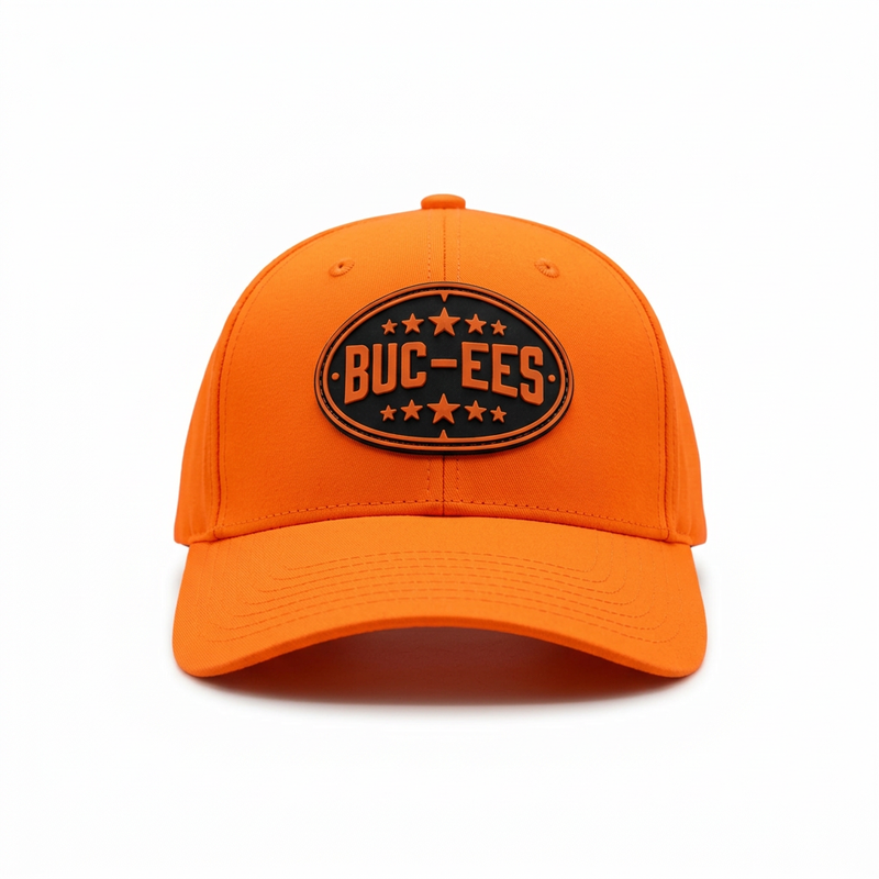 Buc-ee’s Orange Hunter Hat, a blaze orange baseball cap with black oval logo patch and star accents, front view.