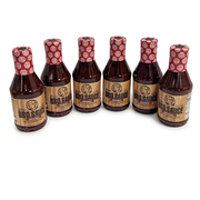 Buc-ee’s Original BBQ Sauce, a case of 6 bottles with wood-grain labels and red caps, for cookouts and catering