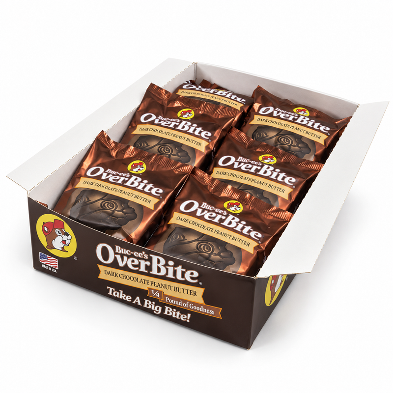Open dark brown Buc-ee's OverBite Dark Chocolate Peanut Butter display box at a three-quarter angle on a white background, showing the bronze-wrapped cookies inside and the branded front and side panels.
