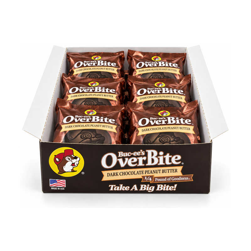 Open Buc-ee's OverBite Dark Chocolate Peanut Butter 12-count box shown straight on against a white background, with the dark brown front panel and six individually wrapped cookies in shiny bronze wrappers visible inside.