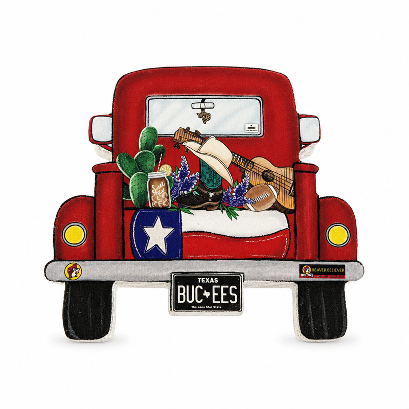 Buc-ee's truck decor shaped like a red vintage pickup with a Texas flag tailgate, bluebonnets, cactus, and BUC-EES plate