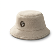 Buc-ee’s Sherpa bucket hat in cream with fuzzy texture and round brown beaver logo patch on the crown